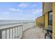 Spacious balcony offers serene ocean views, perfect for enjoying the coastal breeze at 201 W Arctic Ave # 406, Folly Beach, SC 29439