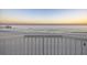 Beautiful beach view from balcony, featuring beach and pier in the distance at 201 W Arctic Ave # 406, Folly Beach, SC 29439