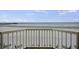 Balcony view showcases the beach and pier; perfect for relaxation and enjoying ocean views at 201 W Arctic Ave # 406, Folly Beach, SC 29439
