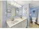 Bathroom with a double sink vanity and a toilet in a separate room at 201 W Arctic Ave # 406, Folly Beach, SC 29439