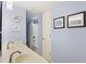 Bathroom with a double sink vanity and a view of the shower at 201 W Arctic Ave # 406, Folly Beach, SC 29439