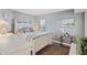Relaxing bedroom with a bed, nightstands, and beach-themed decor at 201 W Arctic Ave # 406, Folly Beach, SC 29439