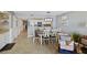 Inviting dining area with seating for six flows into the updated kitchen with stainless appliances and breakfast bar at 201 W Arctic Ave # 406, Folly Beach, SC 29439