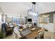 Dining room with table and chairs adjacent to living area, with ocean views at 201 W Arctic Ave # 406, Folly Beach, SC 29439