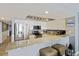 Modern kitchen features stainless steel appliances, granite countertops, and ample cabinet space at 201 W Arctic Ave # 406, Folly Beach, SC 29439