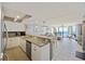 Bright, open kitchen and living area with modern appliances and ocean views at 201 W Arctic Ave # 406, Folly Beach, SC 29439