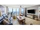 Spacious living room with ocean view and lots of natural light from sliding glass doors at 201 W Arctic Ave # 406, Folly Beach, SC 29439