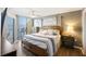 Comfortable main bedroom with balcony access offers ocean views and lots of natural light at 201 W Arctic Ave # 406, Folly Beach, SC 29439