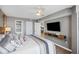 Relaxing main bedroom with large television and views of the kitchen and hallway at 201 W Arctic Ave # 406, Folly Beach, SC 29439