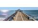 Scenic pier view offering a captivating coastal experience, inviting visitors to explore the ocean's wonders at 201 W Arctic Ave # 406, Folly Beach, SC 29439