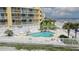 Enjoy community pool with palm trees, beach, and pier views from your condo at 201 W Arctic Ave # 406, Folly Beach, SC 29439