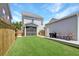 Backyard view showcasing screened porch, deck, grilling area and grassy lawn at 2025 Maybelles Ln, Charleston, SC 29414