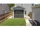 Backyard showing the screened in porch and the grassy area, an idyllic relaxation space at 2025 Maybelles Ln, Charleston, SC 29414