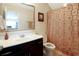 Bathroom with vanity, framed mirror, shower/tub combo with modern bronze colored curtain at 2025 Maybelles Ln, Charleston, SC 29414