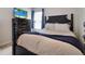 Bedroom featuring a black four-post bed and a chest of drawers with a TV on top at 2025 Maybelles Ln, Charleston, SC 29414
