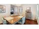 Elegant dining room featuring a wooden table, stylish chairs, and hardwood flooring at 2025 Maybelles Ln, Charleston, SC 29414