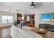 Inviting living room open to the kitchen, featuring a comfortable sofa and entertainment center at 2025 Maybelles Ln, Charleston, SC 29414