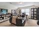 Bright home office space with large window, sports memorabilia, and comfortable seating at 2025 Maybelles Ln, Charleston, SC 29414