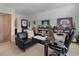 This home office features sports decor, a dark desk and a sitting area for relaxing at 2025 Maybelles Ln, Charleston, SC 29414