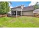 Backyard view of the home with siding, showing deck, screened porch, and a well-maintained lawn at 206 Hawkridge Pl, Goose Creek, SC 29445
