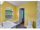 Bright yellow bathroom featuring a vanity, bench and a window with natural light at 206 Hawkridge Pl, Goose Creek, SC 29445