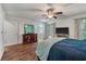 Bright bedroom features hardwood floors, ceiling fan, and ensuite bathroom at 206 Hawkridge Pl, Goose Creek, SC 29445