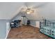 Spacious bonus room with wood floors, vaulted ceiling, and a ceiling fan with space for an office and bedroom at 206 Hawkridge Pl, Goose Creek, SC 29445