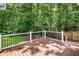 The wooden deck offers a nice outdoor space with railings and ample space to enjoy the backyard scenery at 206 Hawkridge Pl, Goose Creek, SC 29445