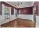Elegant dining room featuring wood floors, wainscoting, and a stylish chandelier for a cozy dining experience at 206 Hawkridge Pl, Goose Creek, SC 29445
