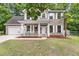 Attractive two-story home with white shutters and a covered front porch, exuding curb appeal at 206 Hawkridge Pl, Goose Creek, SC 29445