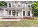 Close up of a charming home featuring a covered porch with pendant lights, ideal for relaxing outdoors at 206 Hawkridge Pl, Goose Creek, SC 29445