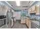 Kitchen featuring stainless steel appliances, ample counter space, and natural light from the window at 206 Hawkridge Pl, Goose Creek, SC 29445