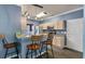 Kitchen with stainless steel appliances, stylish pendant lighting, barstool seating, and blue walls at 206 Hawkridge Pl, Goose Creek, SC 29445