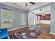 Open-concept living room featuring a ceiling fan, windows, and stylish decor, creating a warm atmosphere at 206 Hawkridge Pl, Goose Creek, SC 29445