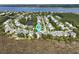 Aerial view of a coastal community featuring scenic pond and waterfront location at 2141 Sandy Point Ln, Mount Pleasant, SC 29466
