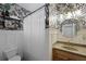 Chic bathroom featuring black and white patterned wallpaper, modern fixtures, and stylish decor at 2141 Sandy Point Ln, Mount Pleasant, SC 29466