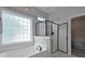 Modern bathroom features a soaking tub, frameless glass shower, and mosaic tile accents at 2141 Sandy Point Ln, Mount Pleasant, SC 29466