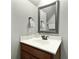 Bathroom with a white countertop, wood cabinets, and chrome hardware for a modern, clean aesthetic at 2141 Sandy Point Ln, Mount Pleasant, SC 29466