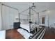 Elegant bedroom boasts hardwood floors, a four-poster bed, and neutral decor for a calming retreat at 2141 Sandy Point Ln, Mount Pleasant, SC 29466