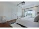 Airy bedroom boasts a large window, hardwood floors, and bright, neutral decor at 2141 Sandy Point Ln, Mount Pleasant, SC 29466