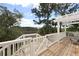 Spacious deck with a pergola offers scenic views of the marshland and surrounding trees at 2141 Sandy Point Ln, Mount Pleasant, SC 29466