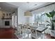 Bright dining area adjacent to fireplace, with french doors and natural light at 2141 Sandy Point Ln, Mount Pleasant, SC 29466
