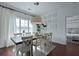 Inviting dining room with large windows, wood table, and stylish decor at 2141 Sandy Point Ln, Mount Pleasant, SC 29466