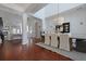 Bright dining room showcasing wood floors, an elegant light fixture, and an open-concept design at 2141 Sandy Point Ln, Mount Pleasant, SC 29466