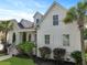 Beautiful home with a well-manicured lawn and lush landscaping at 2141 Sandy Point Ln, Mount Pleasant, SC 29466