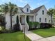 Beautiful home with a well-manicured lawn, a welcoming front porch, and lush landscaping at 2141 Sandy Point Ln, Mount Pleasant, SC 29466
