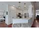 Charming kitchen with white cabinets, stainless steel appliances and stylish lighting at 2141 Sandy Point Ln, Mount Pleasant, SC 29466