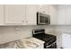 Bright kitchen featuring modern appliances and gorgeous countertops at 2141 Sandy Point Ln, Mount Pleasant, SC 29466