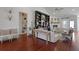 Spacious living area featuring wood floors, custom built-ins, and a cozy fireplace at 2141 Sandy Point Ln, Mount Pleasant, SC 29466
