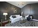 Stylish living room with dark walls, complemented by a white sofa and patterned rug at 2141 Sandy Point Ln, Mount Pleasant, SC 29466